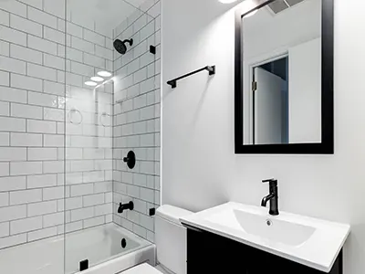 basic bathroom remodel with white tile shower