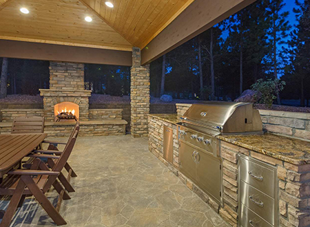 High-End Outdoor Living Space of patio under pavilion with outdoor kitchen