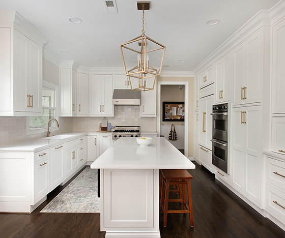All white kitchen with dark wooden floors