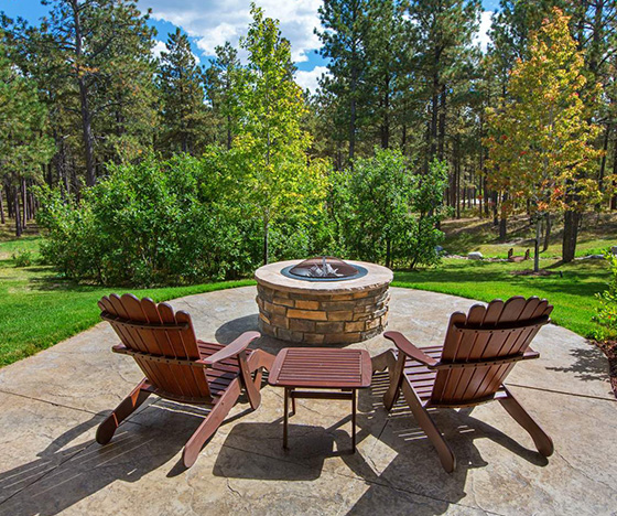 Patio with fire pit and chairs