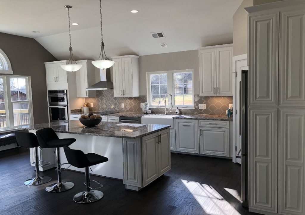 Two pendant lights hanging over a kitchen island