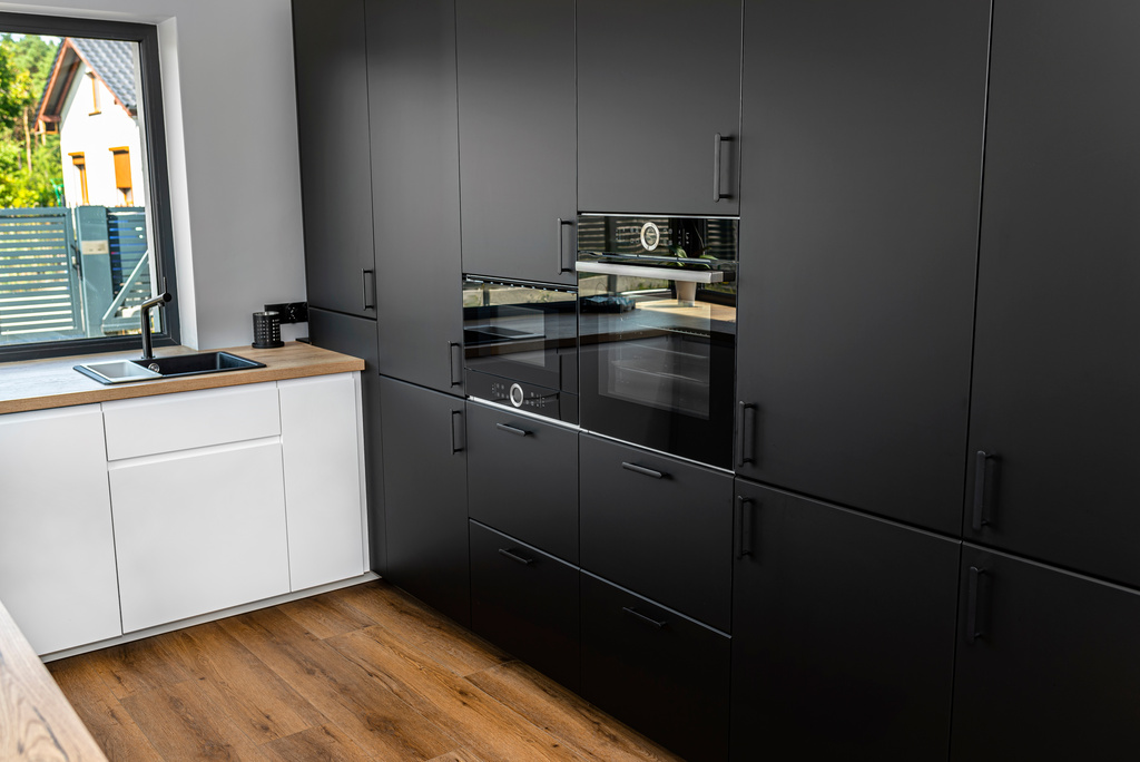 Modern kitchen with black fronts cabinets
