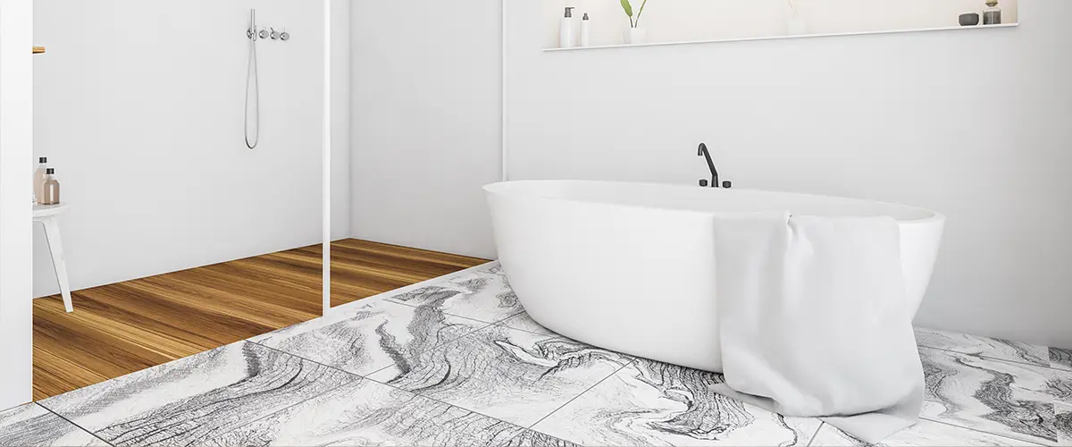 A bathroom floor with a freestanding tub