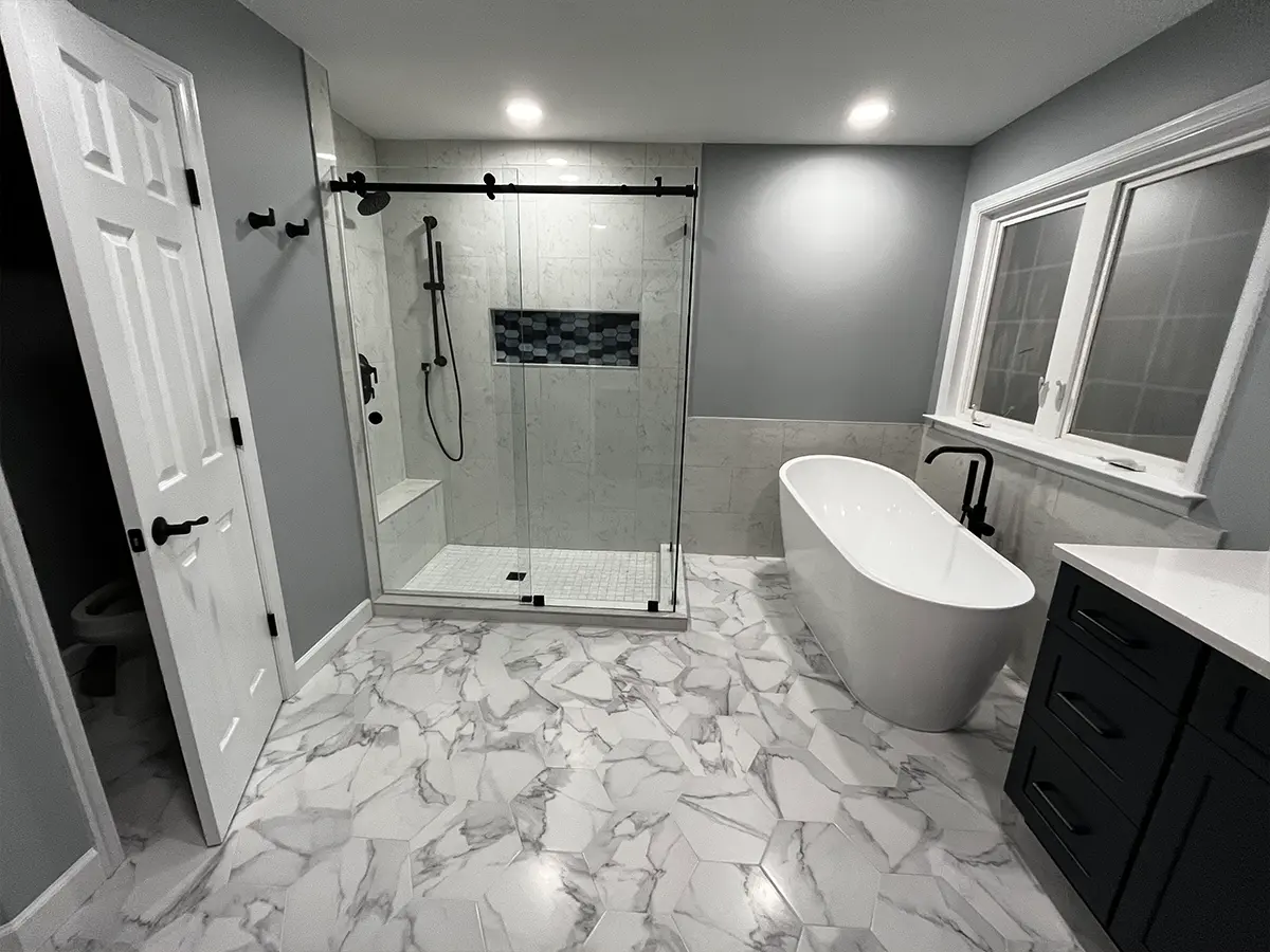Elegant black and white bathroom remodel in Centreville from Gigi Homes and Construction