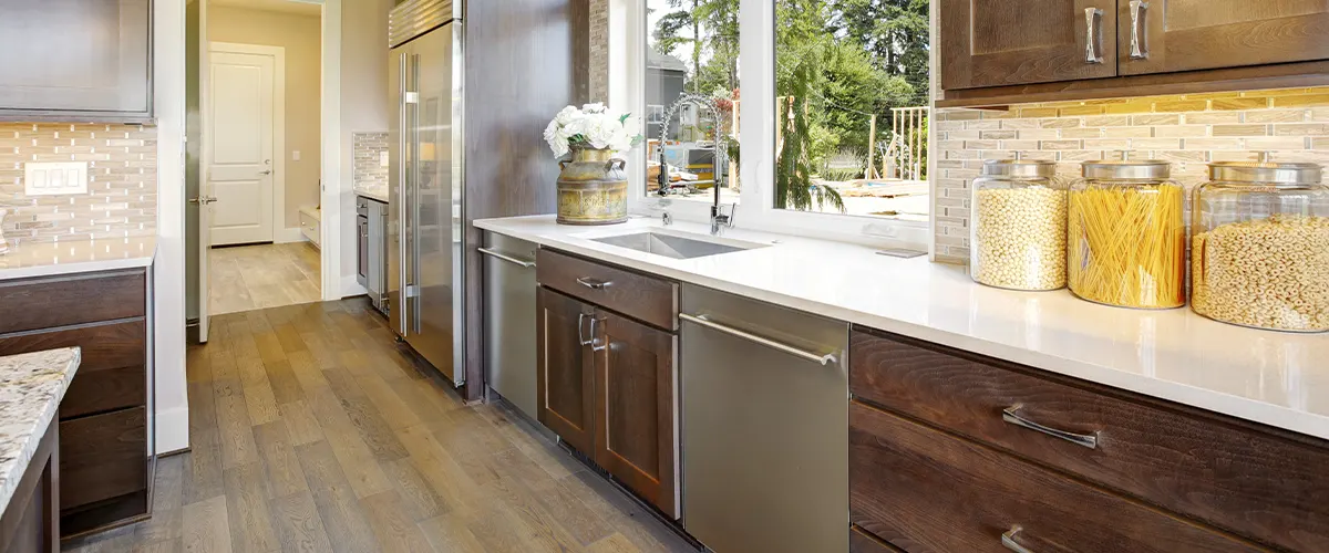 brown kitchen with laminate flooring