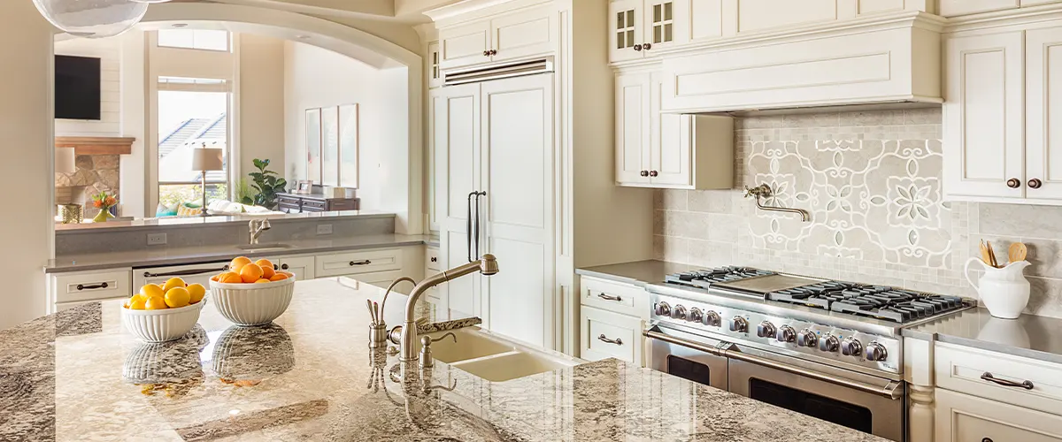 kitchen with marble countertop and tile backsplash