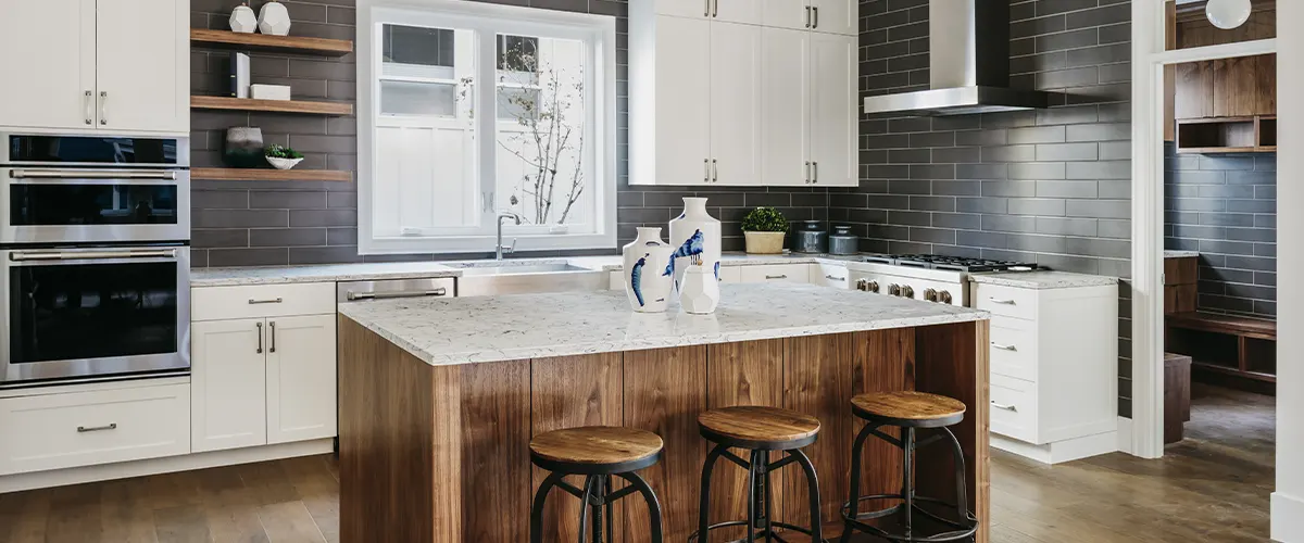 kitchen with wooden island and tile backsplash