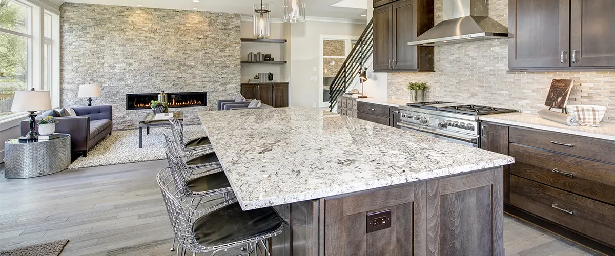 marble countertops on large kitchen island with chairs