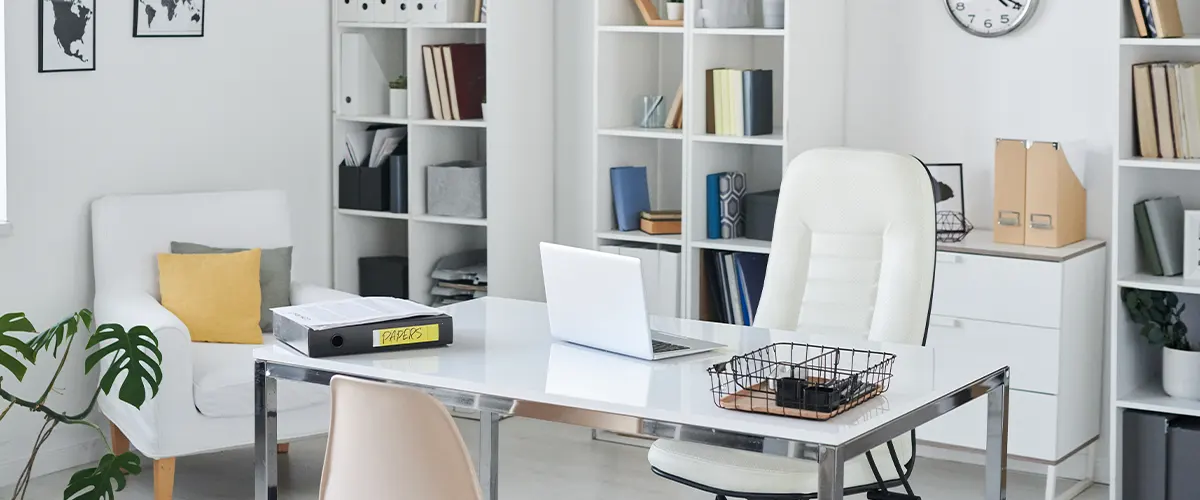 office with white furniture in basement