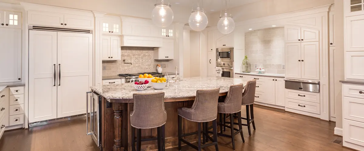 facny kitchen with island and white cabinet