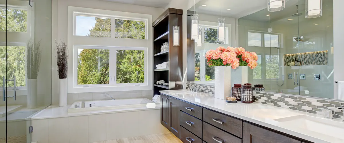 Large bathroom with wooden cabinets and tub