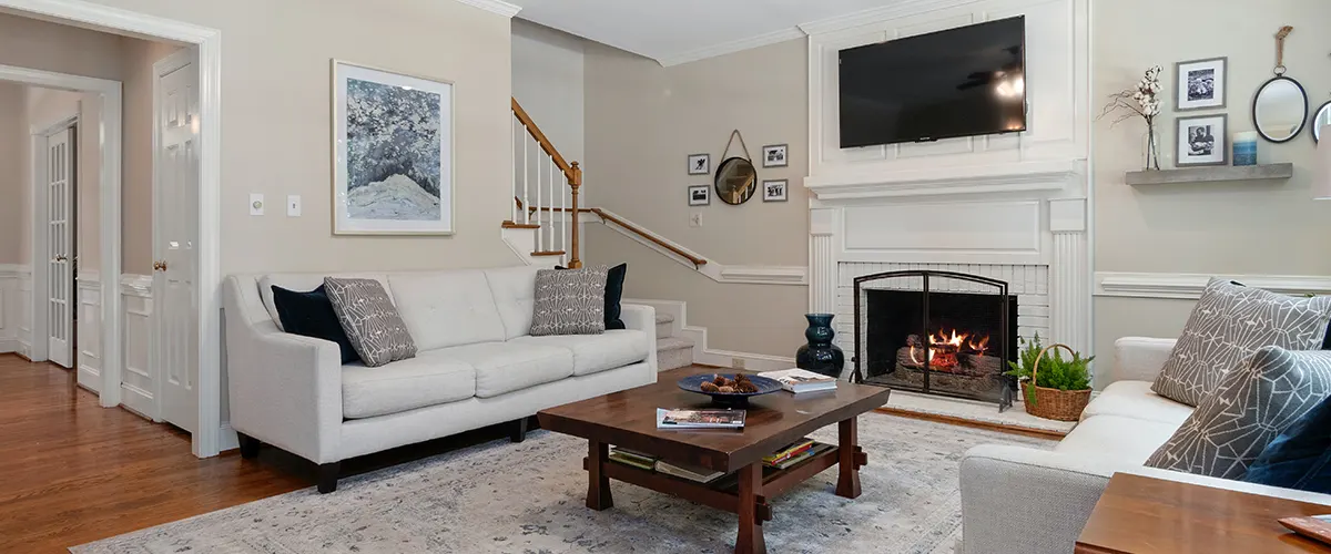 white living froom with sofa and fireplace
