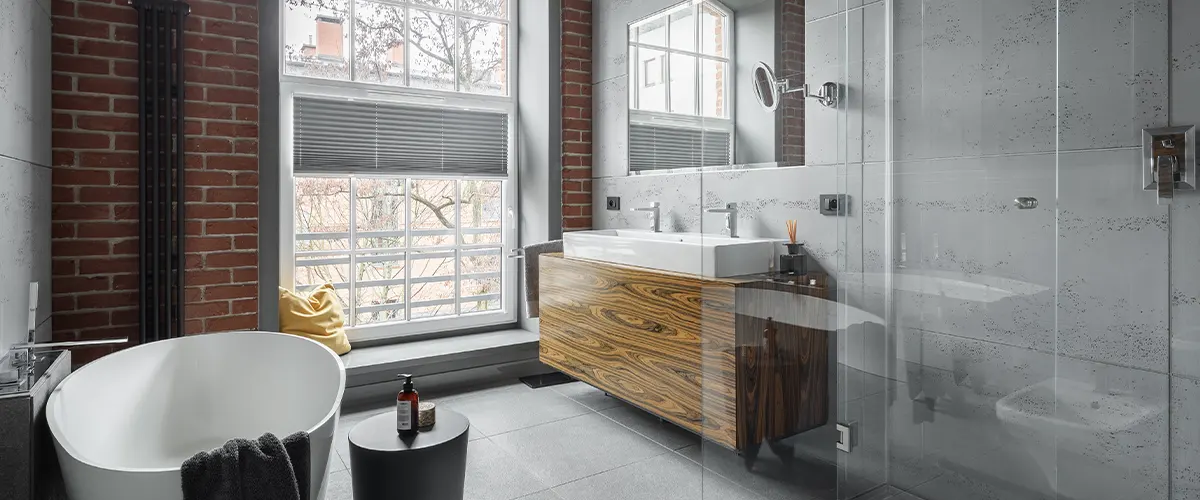 grey bathroom with brick wall