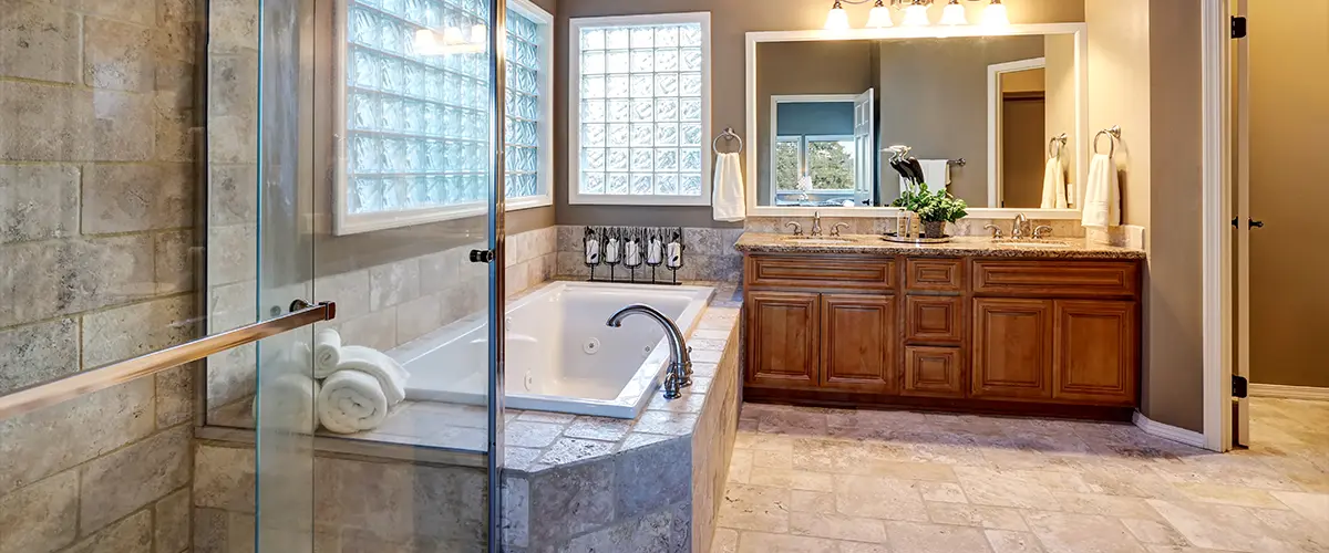 Bull Run bathroom remodel with glass shower, modern bathtub, and vanity.