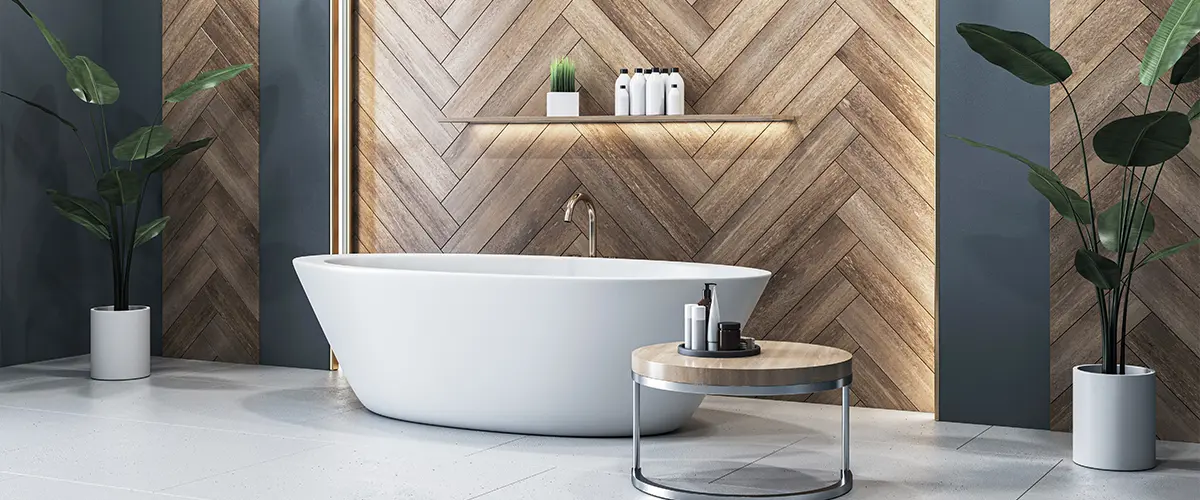 Elegant bathroom with white freestanding tub and wood panel wall. Freestanding Bathtub VS Built-in Tub: A Comprehensive Guide