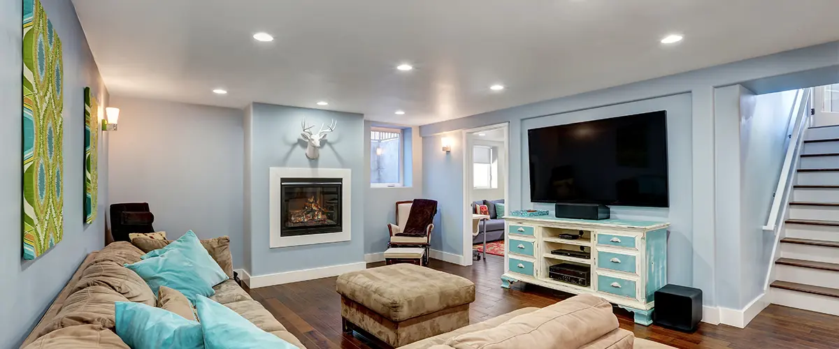 Pastel blue walls in basement living room interior.