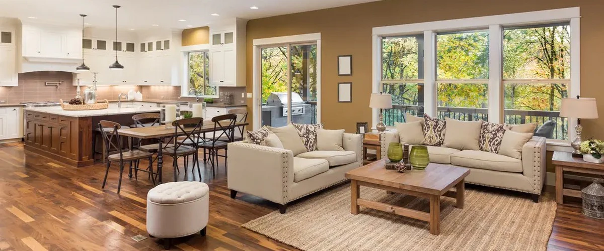 A spacious and bright modern residential home interior featuring contemporary furniture and hardwood flooring.